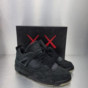KAWS x Air Jordan 4 Retro 'Black' – side view